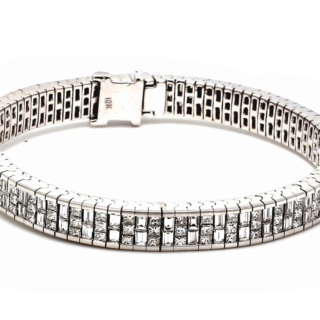 Bracelet in 18K WG w/ invisible set combination of 3-row princess cuts & 2-row baguette diamonds.  D10.91ct.t.w.