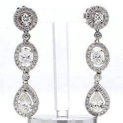Halo dangling earring with bezel and pave set rounds & 4-prong set oval and pear shape diamonds.  D3.08ct.t.w.
