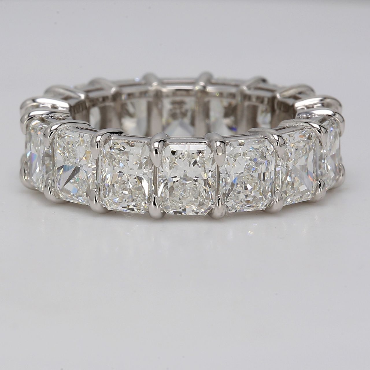 Eternity band in platinum with basket set G-H/VVS-VS (16) radiant cut diamonds.  D8.79ct.t.w.  Size 6.5