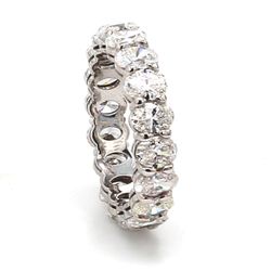 Eternity band in platinum with basket prong set (18) oval cut diamonds.  D3.35ct.t.w.  Size 4.75