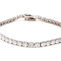 7' Tennis bracelet east to west style with 4-prong set (46) oval diamonds.  D6.42ct.t.w.