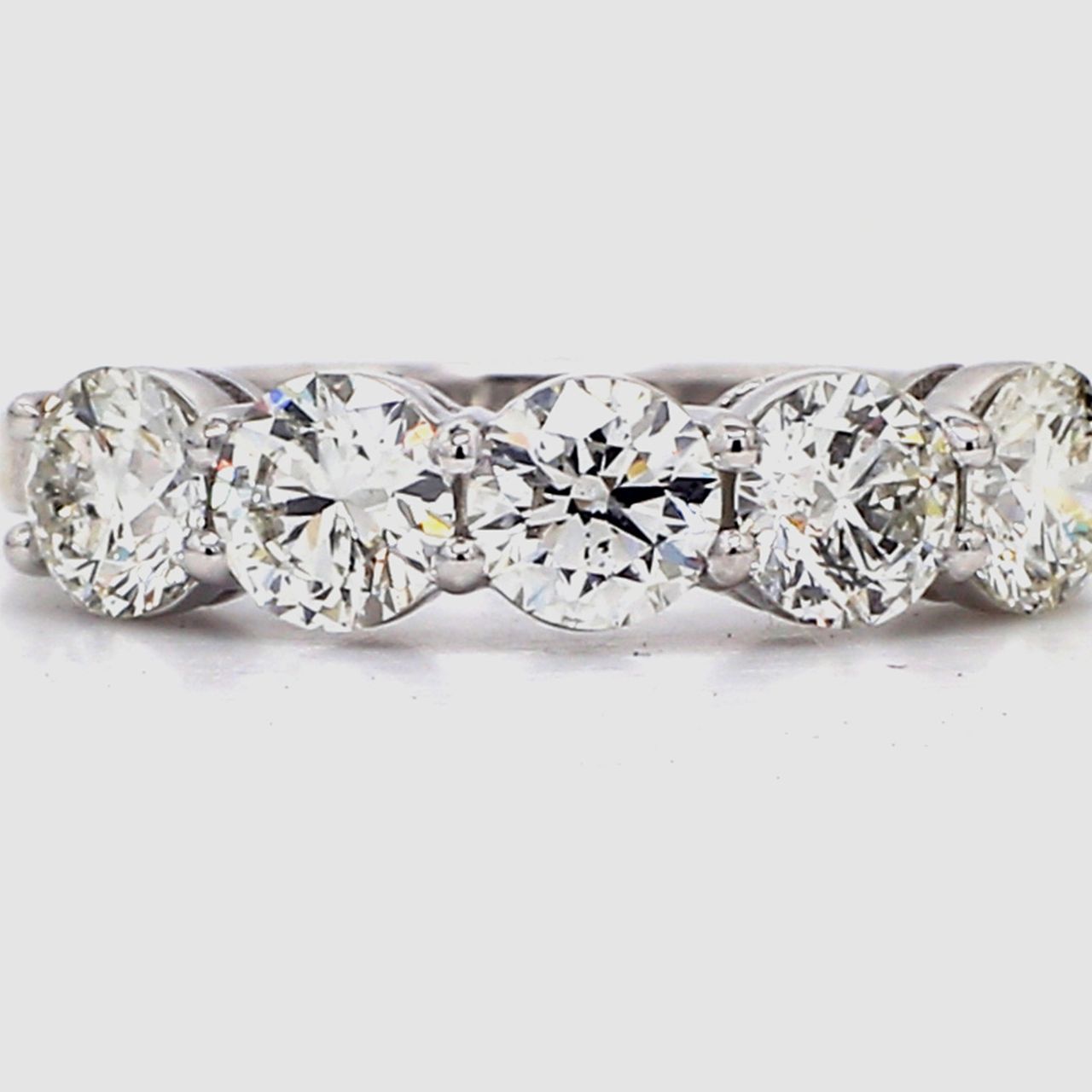 5-stone band in platinum with basket prong set round diamonds.  D1.51ct.t.w.  Size 5.5