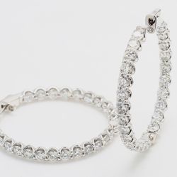 1.20' Inside out hoop earrings with U-prong set (50) round diamonds.  D5.25ct.t.w.