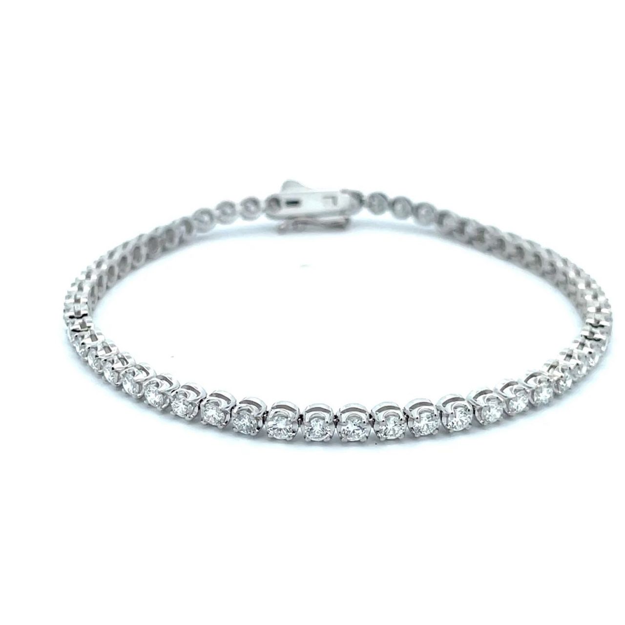 7' Tennis bracelet with illusion head 4-prong set (54) round diamonds.  D3.07ct.t.w.