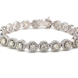 7' Halo tennis bracelet with prong set round diamonds.  D7.23ct.t.w.