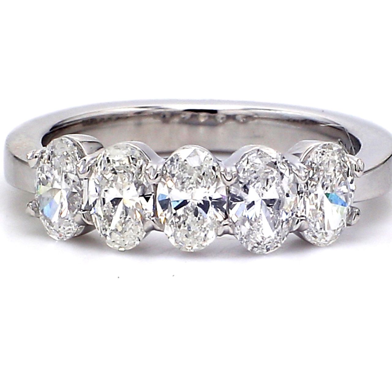 5-stone band in platinum with basket prong set oval cut diamonds.  D1.40ct.t.w.  Size 6