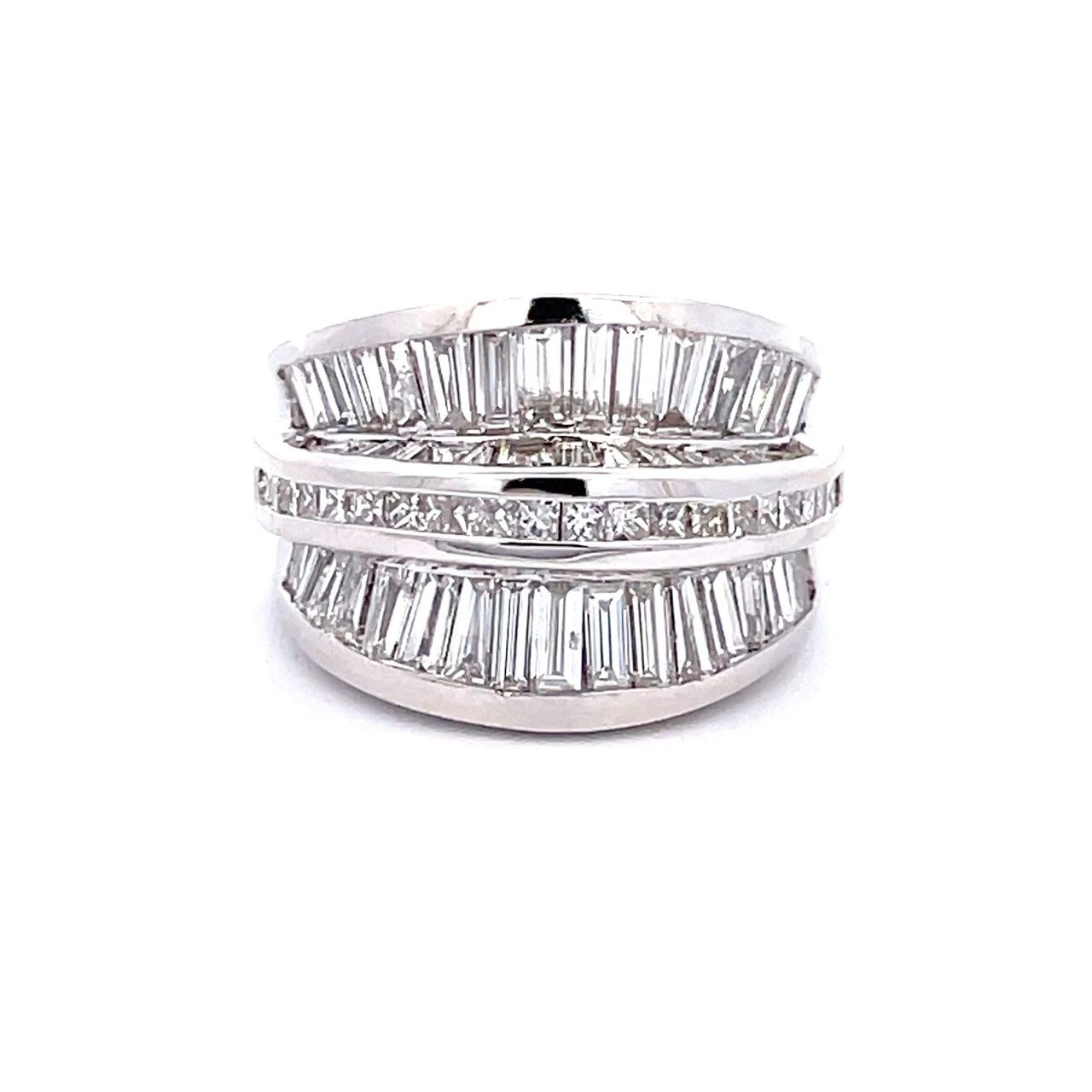 Band in 18K WG with channel set princess cut and baguette diamonds.  D4.23ct.t.w.  Size 6.75