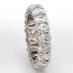 Eternity band in platinum with basket shared prong set (19) oval diamonds.  D4.70ct.t.w.  Size 6.75