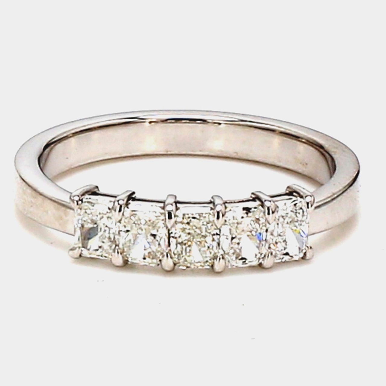 5-stone band in platinum with basket prong set radiant cut diamonds.  D0.72ct.t.w.  Size 5.5
