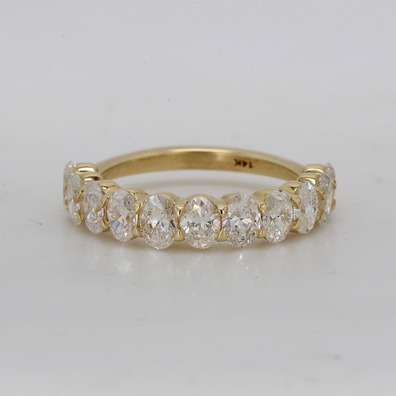 Single row band in 14K YG with prong set (11) oval diamonds.  D1.64ct.t.w.  Size 5