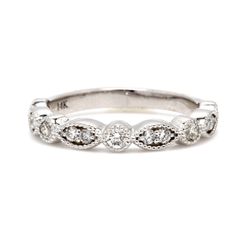 13-stone band with prong set round diamonds.  D0.33ct.t.w.  Size 4.5