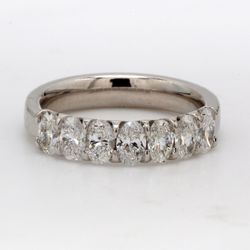 7-stone band in platinum with U-prong set oval cut diamonds.  D1.30ct.t.w.  Size 6