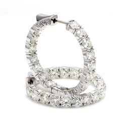 1.25' Inside out hoop earrings in 18K WG with 4-prong set (34) round diamonds & with special spring lock.  D8.51ct.t.w.