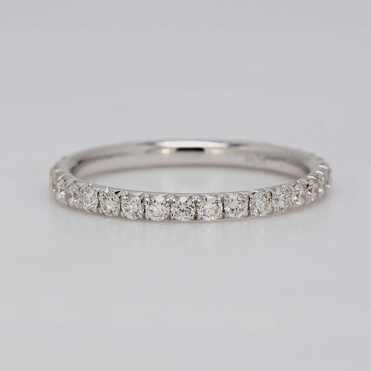 Eternity band in 18K WG with french pave set round diamonds.  D0.59ct.t.w.  Size 5