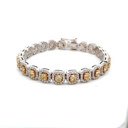 Halo bracelet with prong set rounds around (23) fancy yellow cushion diamond center stones.  D10.73ct.t.w.  (Center - 7.15ct.t.w.)