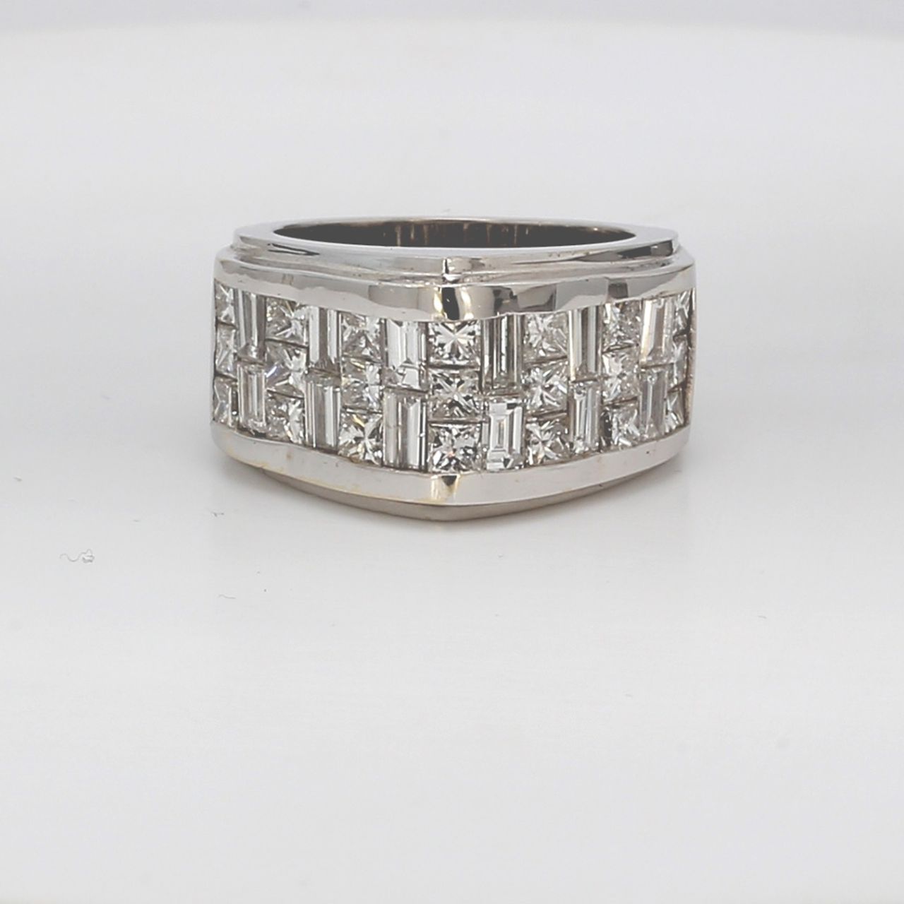 Pointed top band with 3-row invisible set princess cut and baguette diamonds.  D3.80ct.t.w.