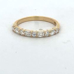 Single row band in 18K YG with prong set alternating (4) emerald cut and (5) round diamonds.  D0.57ct.t.w.  Size 6