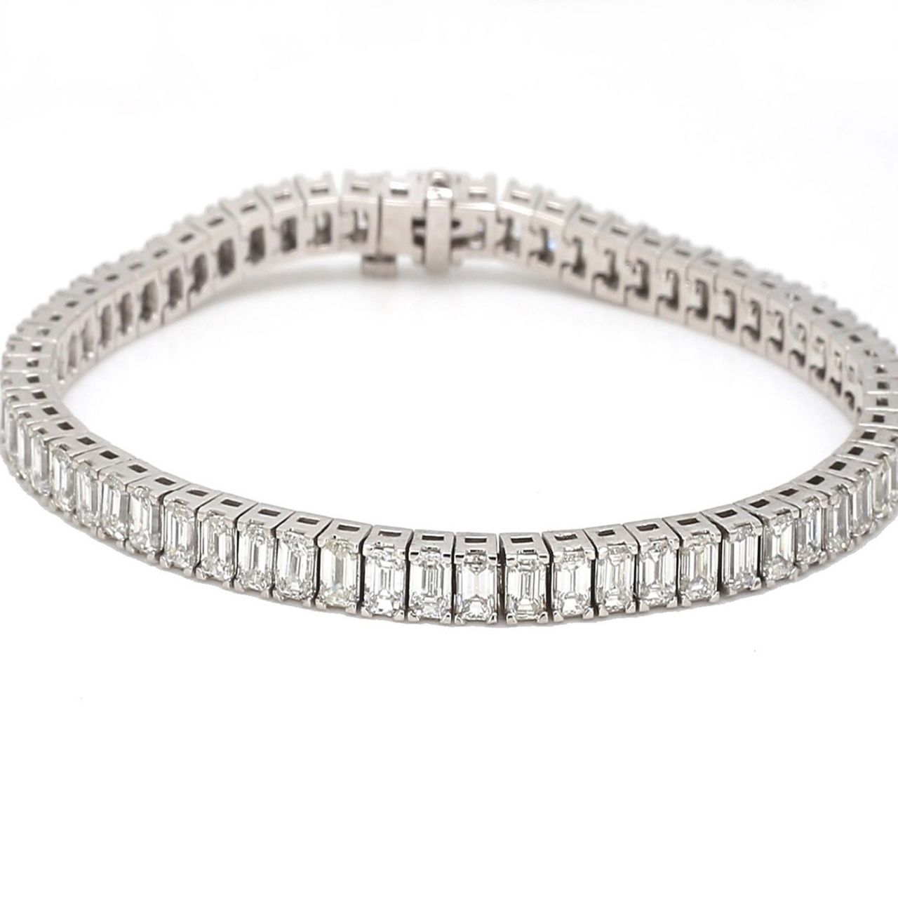 7' Tennis bracelet in platinum with 4-prong basket set emerald cut diamonds.  D8.85ct.t.w.