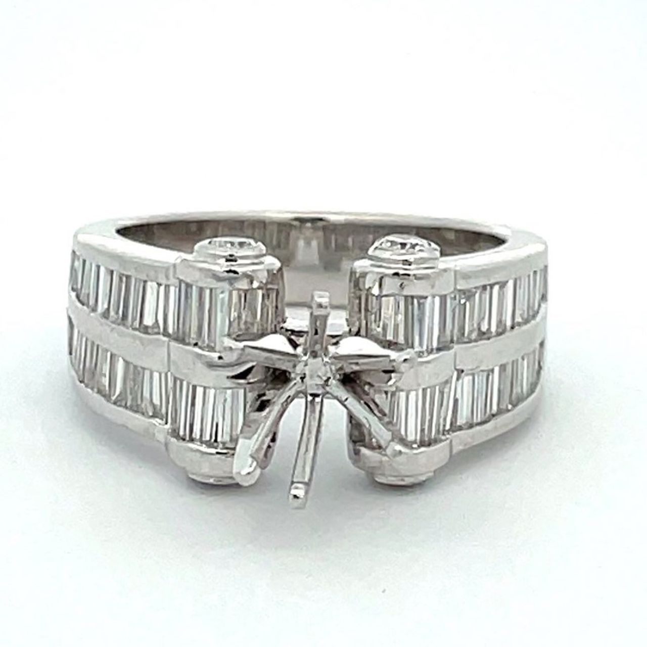 Scroll-top semi-mount in platinum with bezel set rounds on scrolls & channel set baguette diamonds.  D2.60ct.t.w.