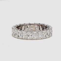 Eternity band with shared basket prong set (23) radiant cut diamonds.  D3.65ct.t.w.  Size 5