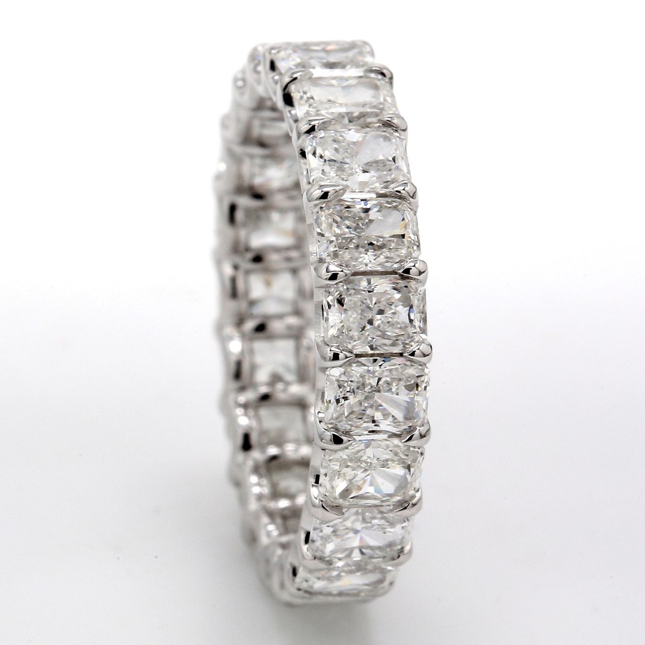 Eternity band in platinum with shared U-prong set (21) radiant cut diamonds.  D5.19ct.t.w.  Size 8