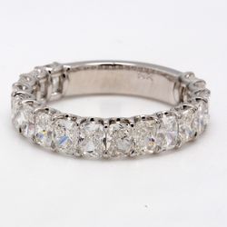 Band in 18K WG with U-prong set (17) radiant cut diamonds.  D4.31ct.t.w.  Size 8.75
