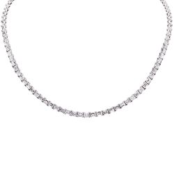 17' Tennis necklace east to west style in 18K WG with basket prong set (95) emerald cut diamonds.  D28.11ct.t.w.