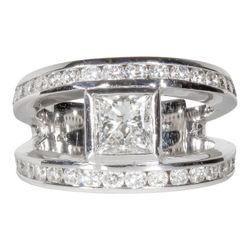 Open shank ring with channel set rounds and bezel set princess cut diamond center stone.  D2.24ct.t.w.  (Center 0.96ct.)