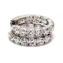 0.75' Oval shaped inside out hoop earrings with 4-prong set (20) round diamonds & with special spring  lock.  D4.77ct.t.w.