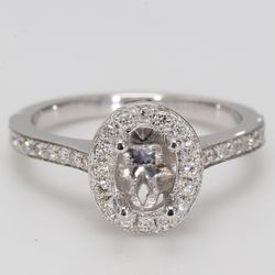 Halo semi-mount with shared prong round diamonds.  D0.42ct.t.w.