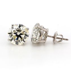 Screw back stud earrings with 4-prong set USA certified H-I/SI3 round diamonds.  D6.02ct.t.w.