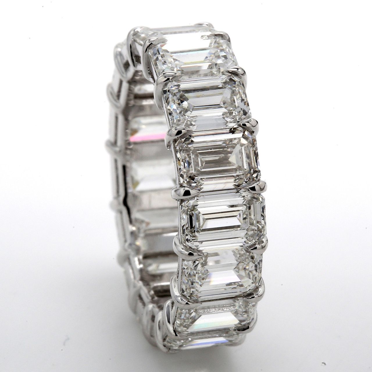 Eternity band in platinum with basket claw set GIA certified G-I/VVS1-VS2 (16) emerald cut diamonds.  D9.62ct.t.w.  Size 5.75