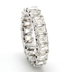 Eternity band in 18K WG with shared claw U-prong set (19) emerald cut diamonds.  D5.72ct.t.w.  Size 5