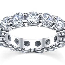 Eternity band with shared prong set (14) round diamonds.  D4.80ct.t.w.  Size 5.25