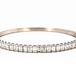 Half way bangle with basket prong  set (27) emerald cut diamonds.  D6.26ct.t.w.