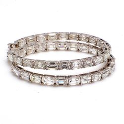 1.5' Inside out hoop earrings in 18K WG with prong basket set (42) emerald cut diamonds.  D10.43ct.t.w.