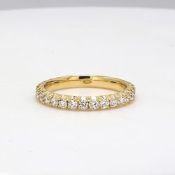 Eternity band in 18K YG with 4-prong basket set round diamonds.  D1.11ct.t.w.  Size 7