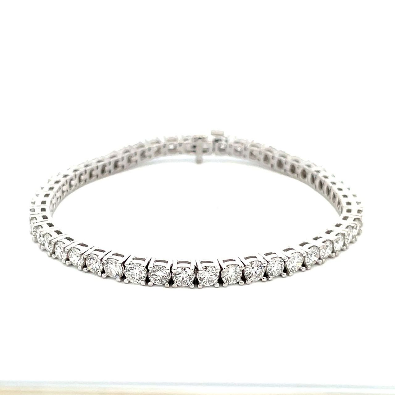 7' Tennis bracelet in platinum with 4-prong basket set (46) round diamonds.  D10.98ct.t.w.