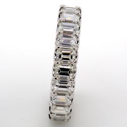 Eternity band in platinum with U-prong set (23) emerald cut diamonds.  D5.54ct.t.w.  Size 8