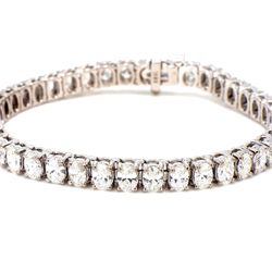 7' Tennis bracelet in 18K WG with prong set (41) oval cut diamonds.  D10.85ct.t.w.