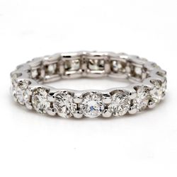Eternity band with U-prong set round diamonds.  D3.09ct.t.w.