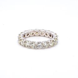 Eternity band with U-prong set (18) round diamonds.  D3.93ct.t.w.