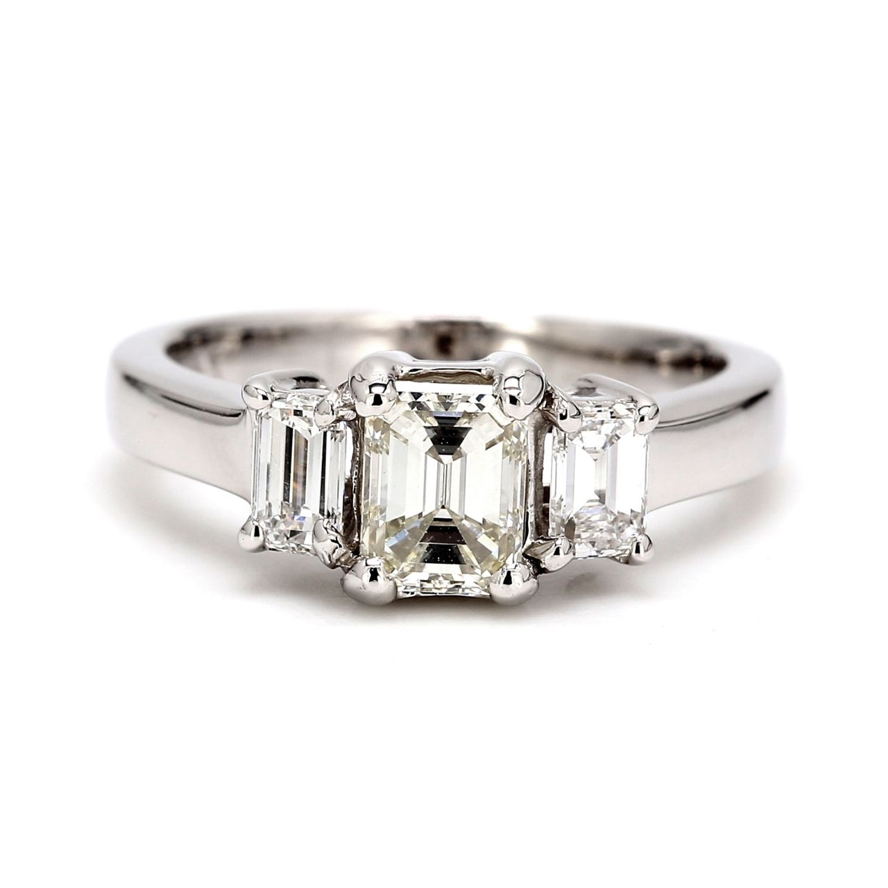 Three-stone semi-mount in platinum with emerald cut diamonds sides.  D0.45ct.t.w.