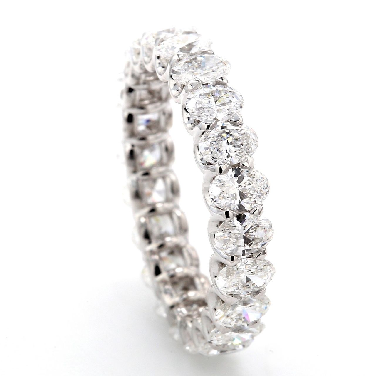 Eternity band with shared U-prong set F/VS+ (22) oval diamonds.  D3.20ct.t.w.  Size 6