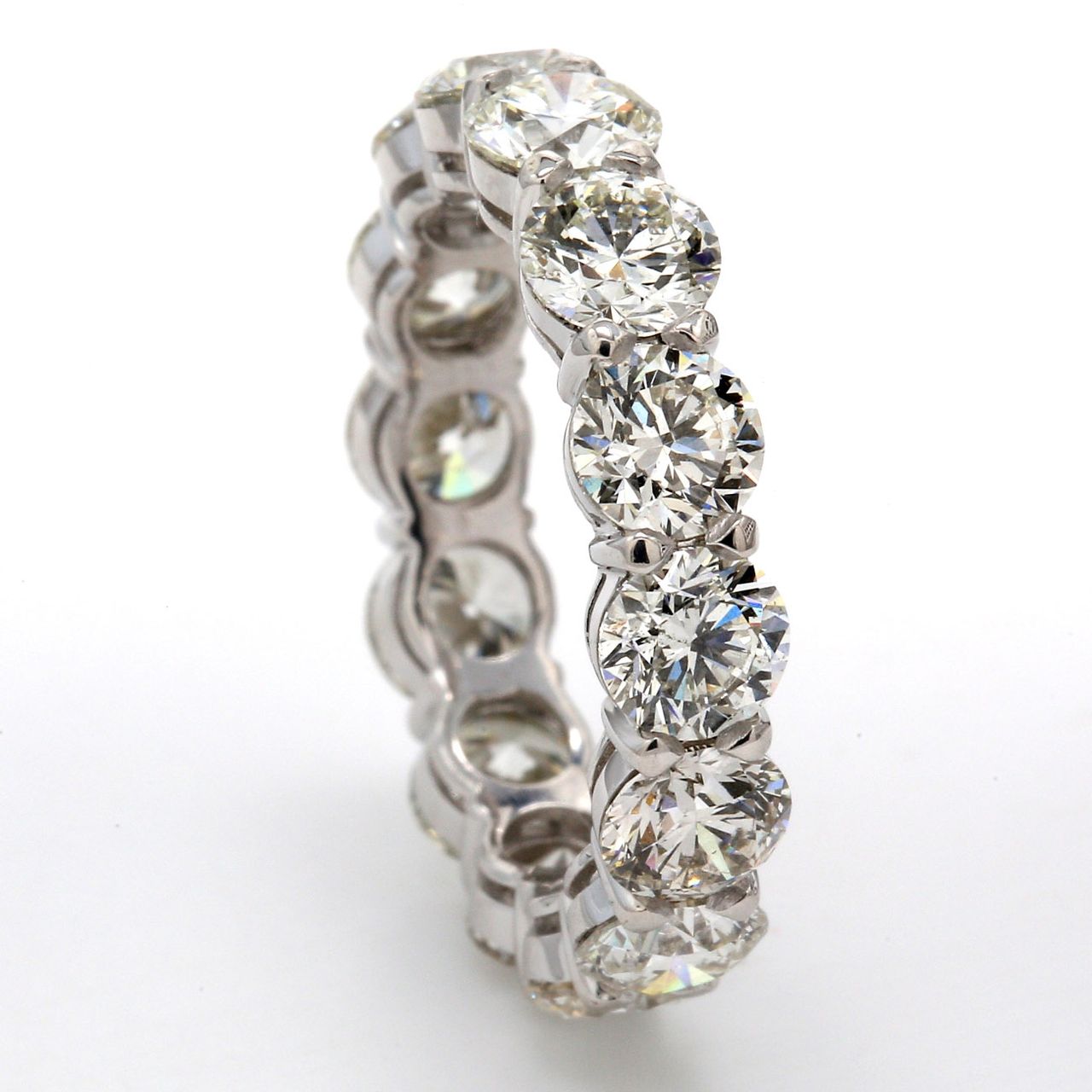 Eternity band in platinum with basket claw set (14) round diamonds.  D5.61ct.t.w.  Size 6.5