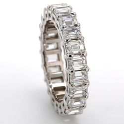 Eternity band in platinum with basket prong set (22) emerald cut diamonds.  D4.08ct.t.w.  Size 5