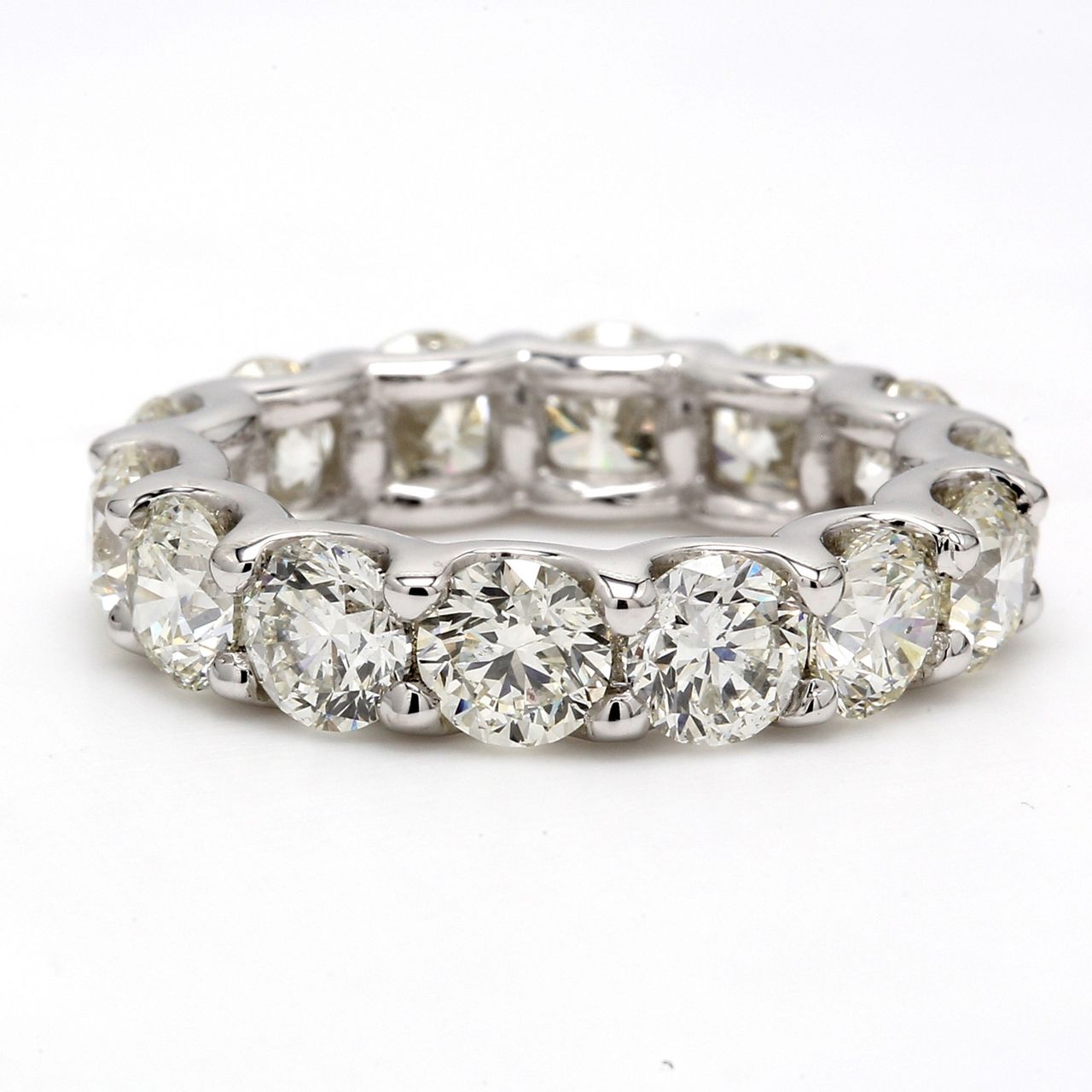 Eternity band in platinum with shared U-prong set (15) round diamonds.  D4.59ct.t.w.  Size 6