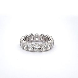 Eternity band in platinum with shared basket prong set GIA certified G-I/VS1-SI1 (16) oval cut diamonds.  D6.52ct.t.w.  Size 6.75