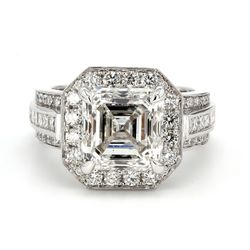 Halo semi-mount with channel set princess cuts and pave set round diamonds.  D1.50ct.t.w.