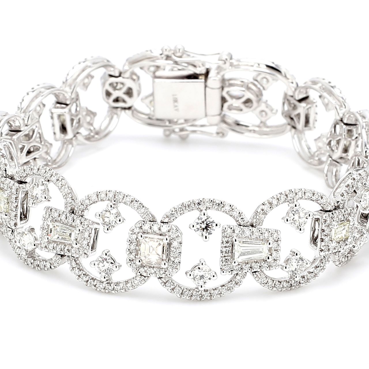 Designer halo bracelet in 18K WG with french pave set round diamond sides & prong set rounds and fancy shape diamond centers.  D7.48ct.t.w.